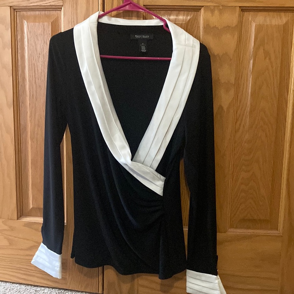 Women’s black with white detail, long sleeved top.